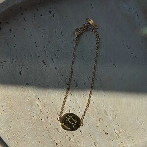 THE REVERSIBLE ZODIAC DISC BRACELET